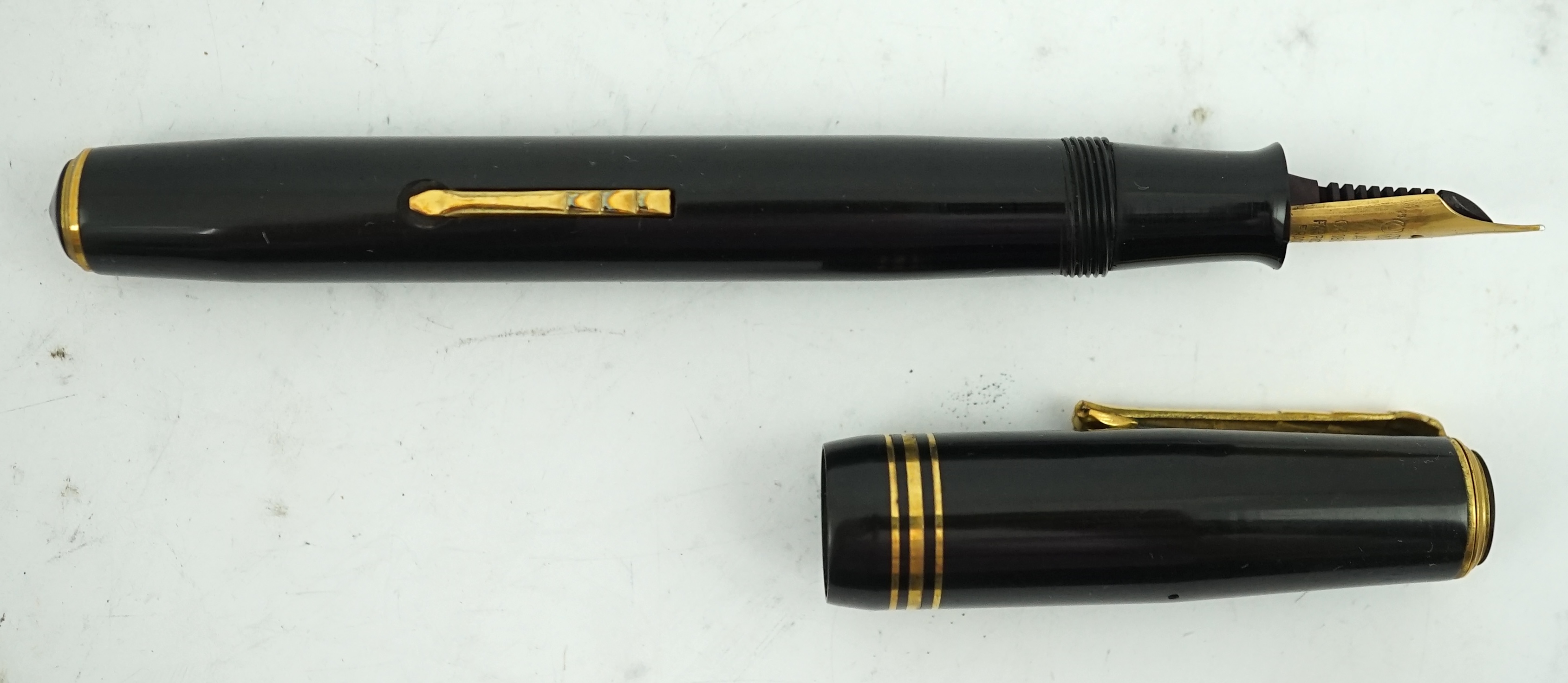 Four sundry fountain pens to include a silver hallmarked Eyedropper